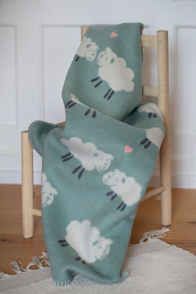 MILA baby blanket "sheep allover" in . Blanket made by David Fussenegger , a family-run mill in Austria.