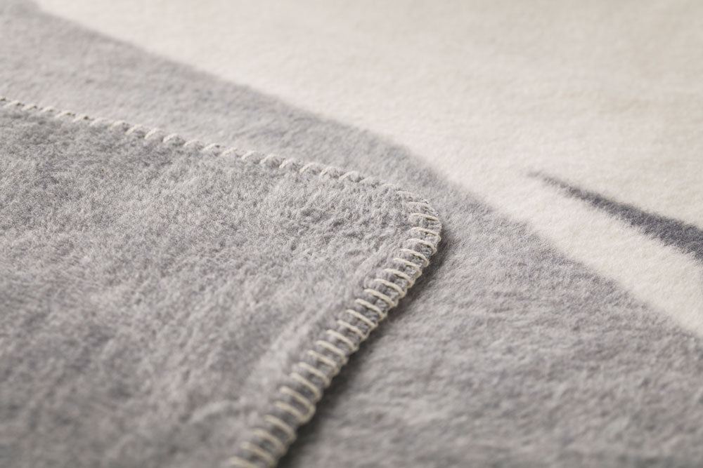 SAVONA throw "wanderlust" in . Throw Blanket made by David Fussenegger , a family-run mill in Austria.