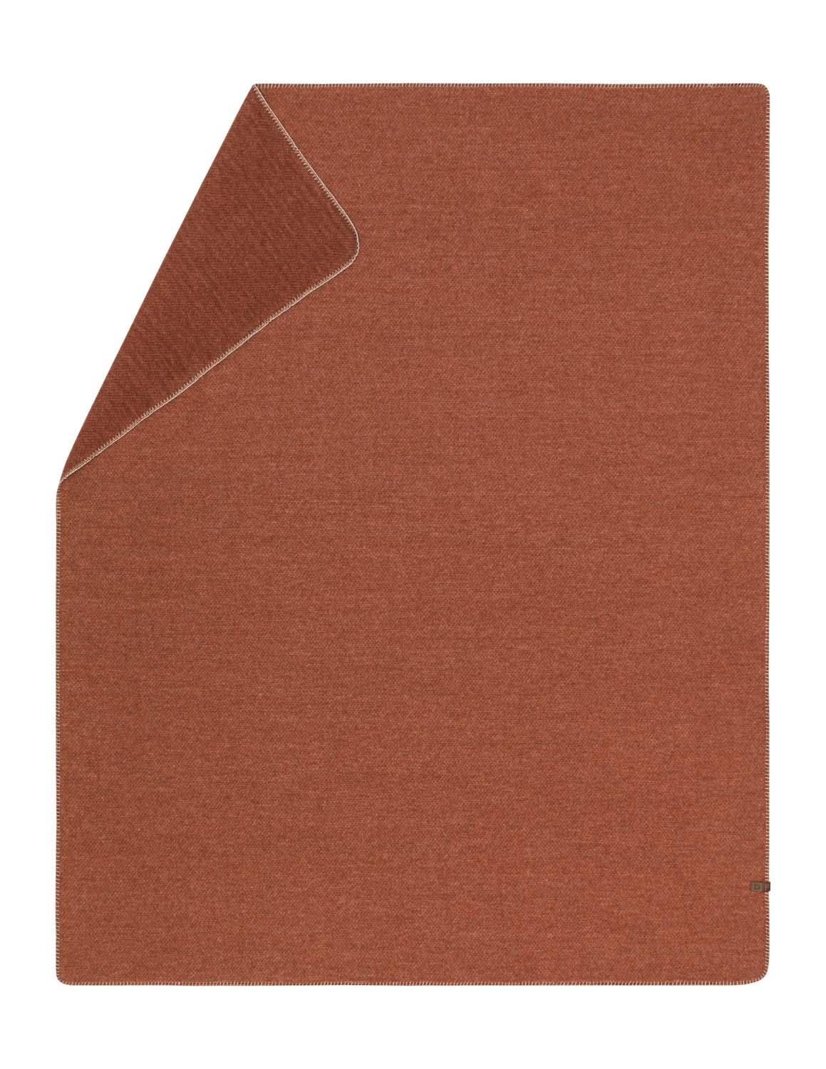 MERANO throw "faux solid" in terracotta . made by INDIGO 11 , a family-run mill in Austria.