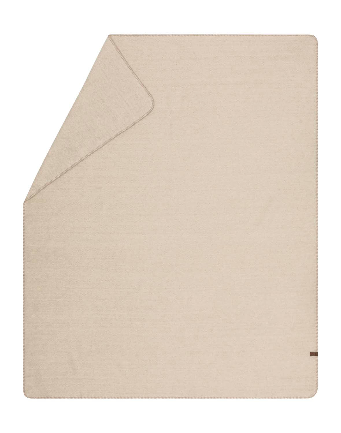 MERANO throw "faux solid" in . made by INDIGO 11 , a family-run mill in Austria.