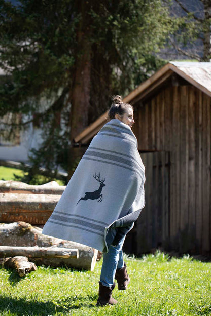 LUCA throw flannel "jumping stag / stripes" in . Throw Blanket made by David Fussenegger , a family-run mill in Austria.
