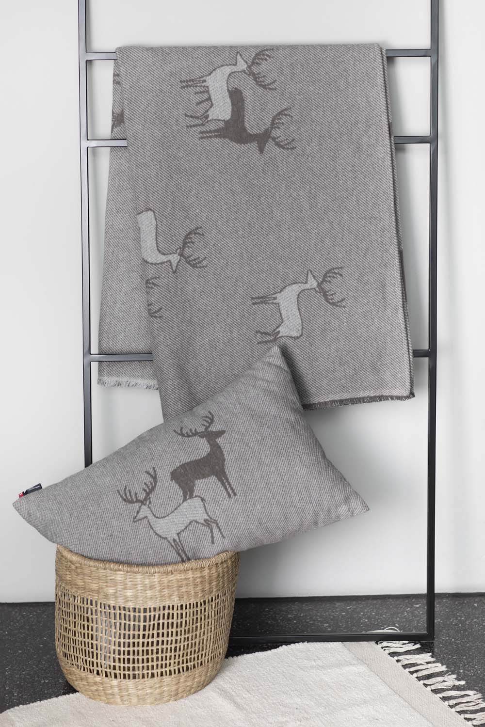 LUCA throw "pairs of stags" in . Throw Blanket made by David Fussenegger , a family-run mill in Austria.