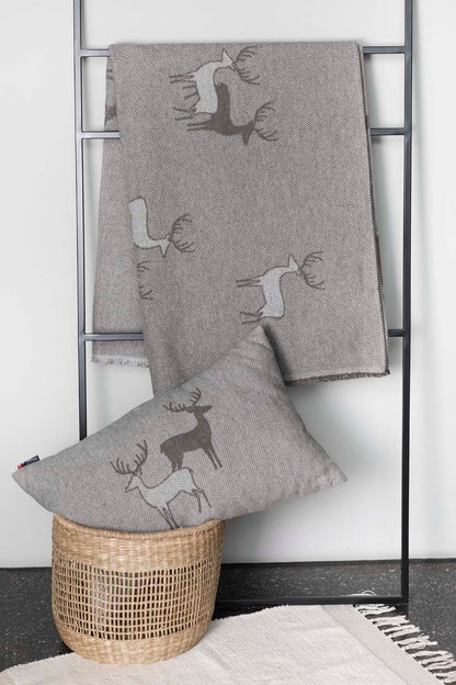 LUCA throw "pairs of stags" in . Throw Blanket made by David Fussenegger , a family-run mill in Austria.