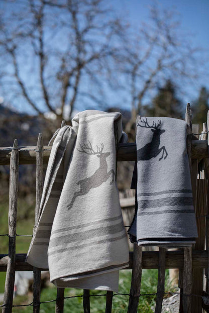 LUCA throw flannel "jumping stag / stripes" in . Throw Blanket made by David Fussenegger , a family-run mill in Austria.
