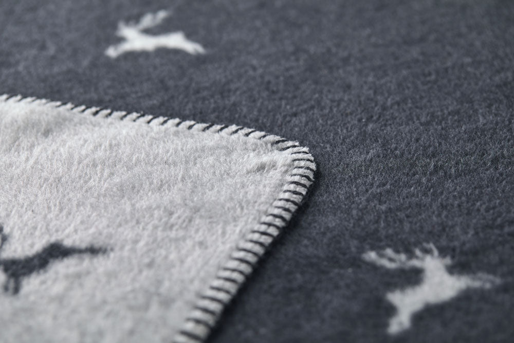 SAVONA throw "deer allover" in . Throw Blanket made by David Fussenegger , a family-run mill in Austria.