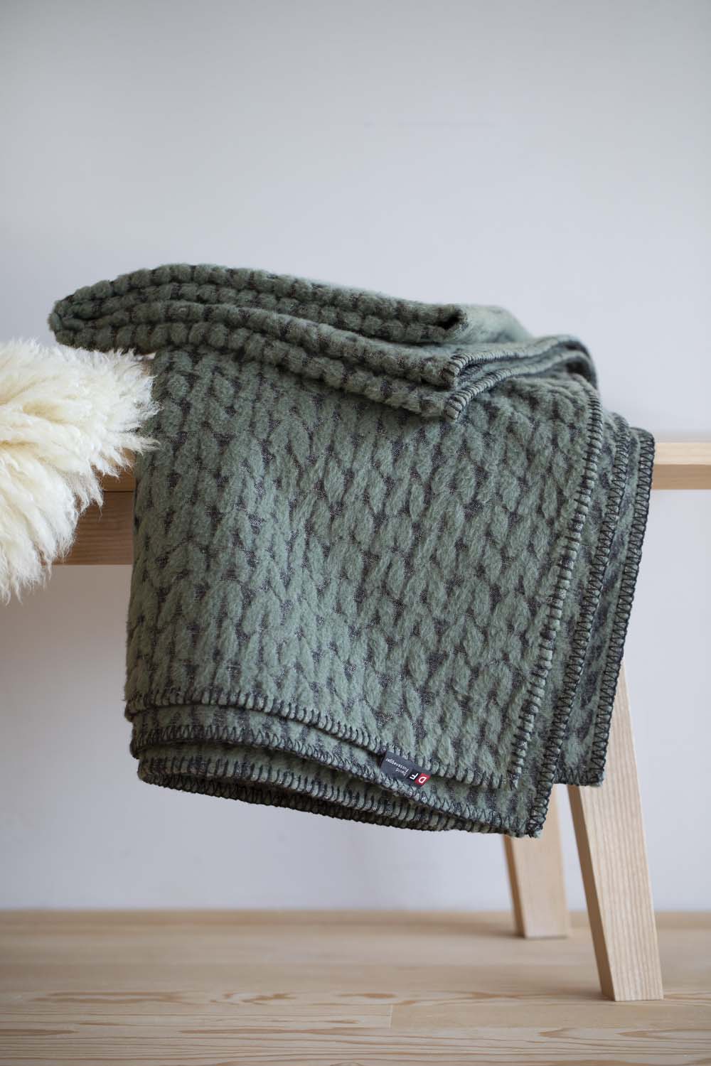 CARLA throw "knitted pattern" in . Throw Blanket made by David Fussenegger , a family-run mill in Austria.