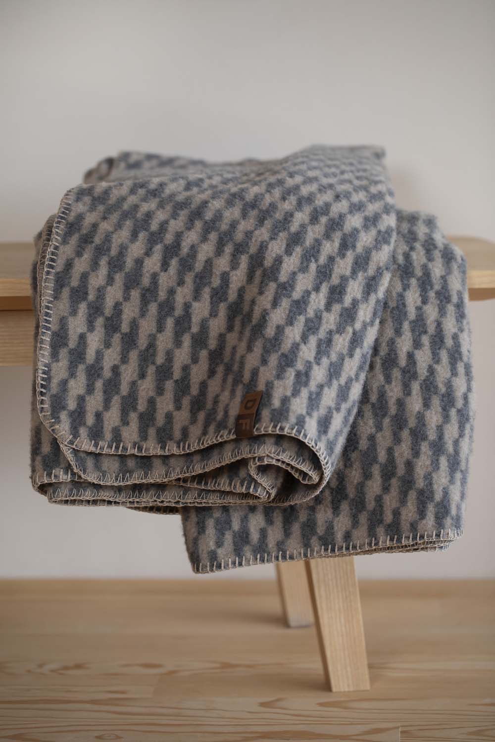 MERANO throw "houndstooth" in . made by INDIGO 11 , a family-run mill in Austria.