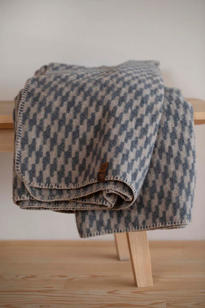 MERANO throw "houndstooth" in . made by INDIGO 11 , a family-run mill in Austria.