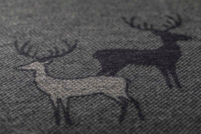 LUCA throw "pairs of stags" in . Throw Blanket made by David Fussenegger , a family-run mill in Austria.