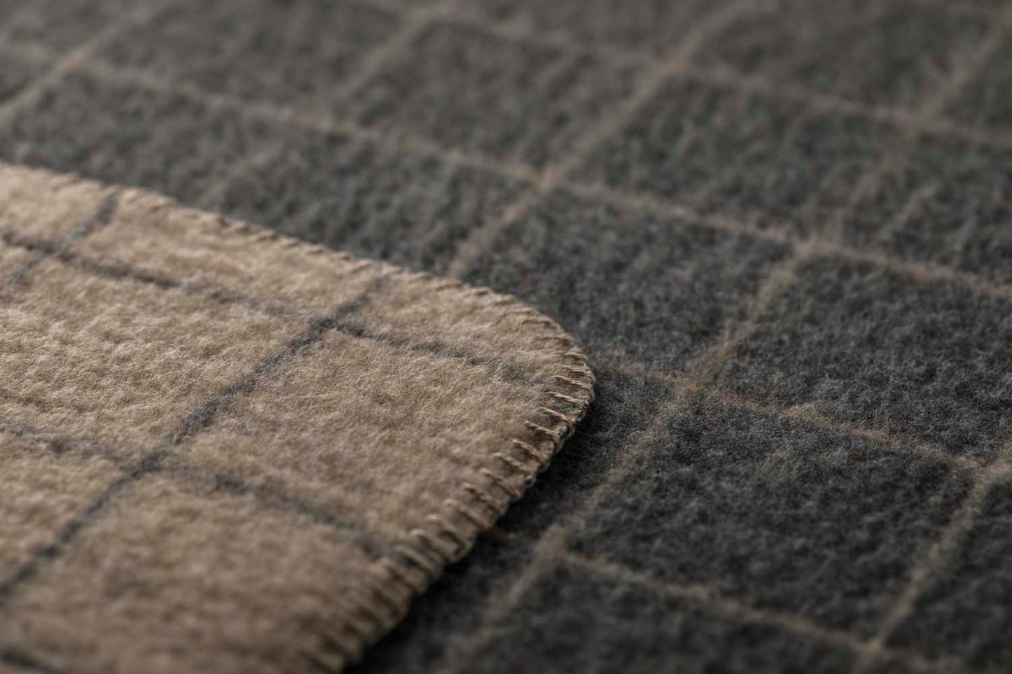 MERANO throw "checkered" in . made by INDIGO 11 , a family-run mill in Austria.