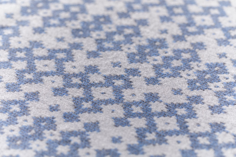 NOVA throw "small ethnic pattern" in . Throw Blanket made by David Fussenegger , a family-run mill in Austria.