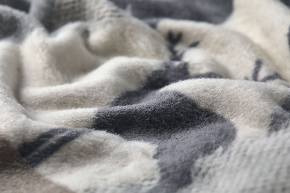 SAVONA throw "mountains modern" in . Throw Blanket made by David Fussenegger , a family-run mill in Austria.