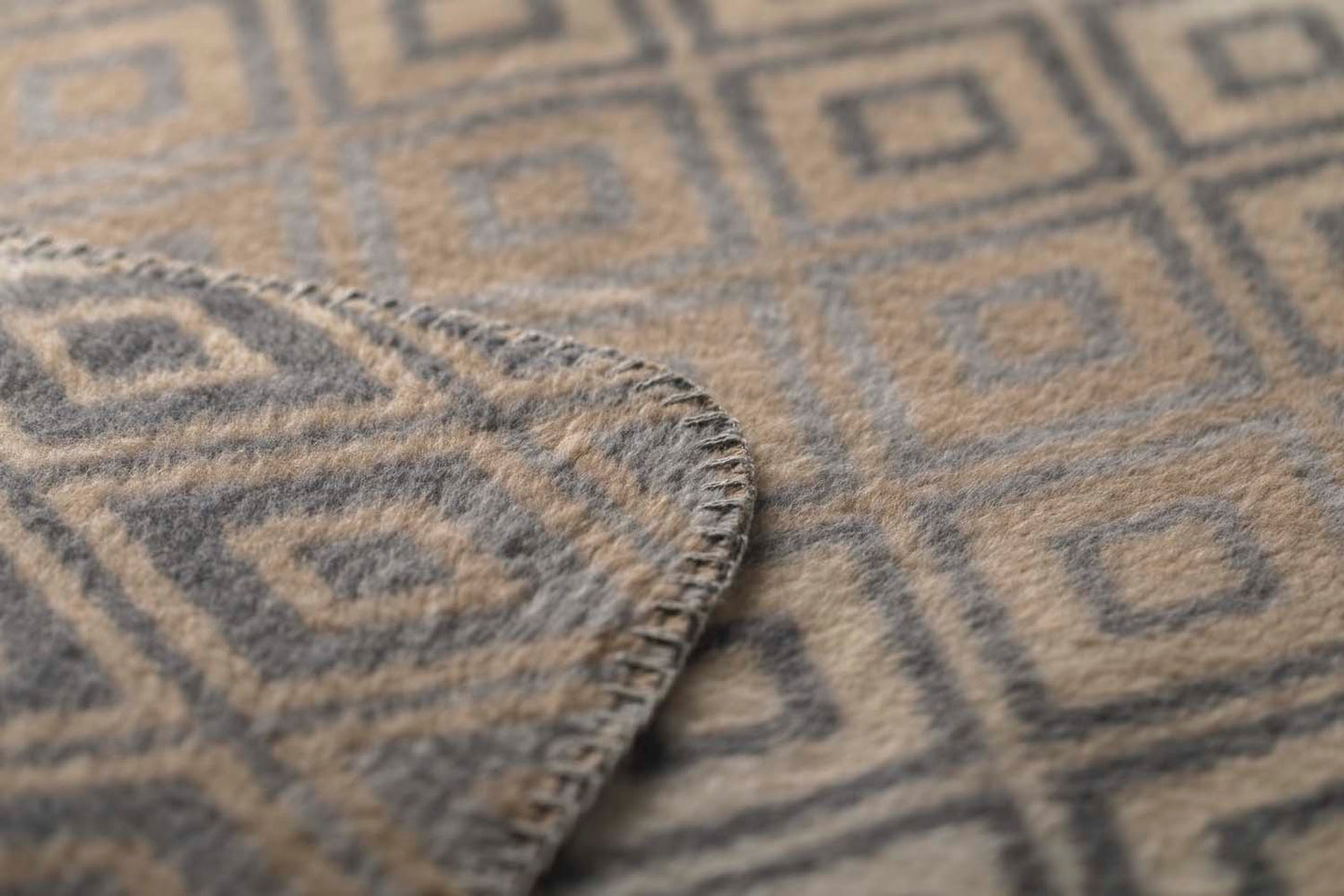 SAVONA throw "lozenge shapes gradient" in . Throw Blanket made by David Fussenegger , a family-run mill in Austria.