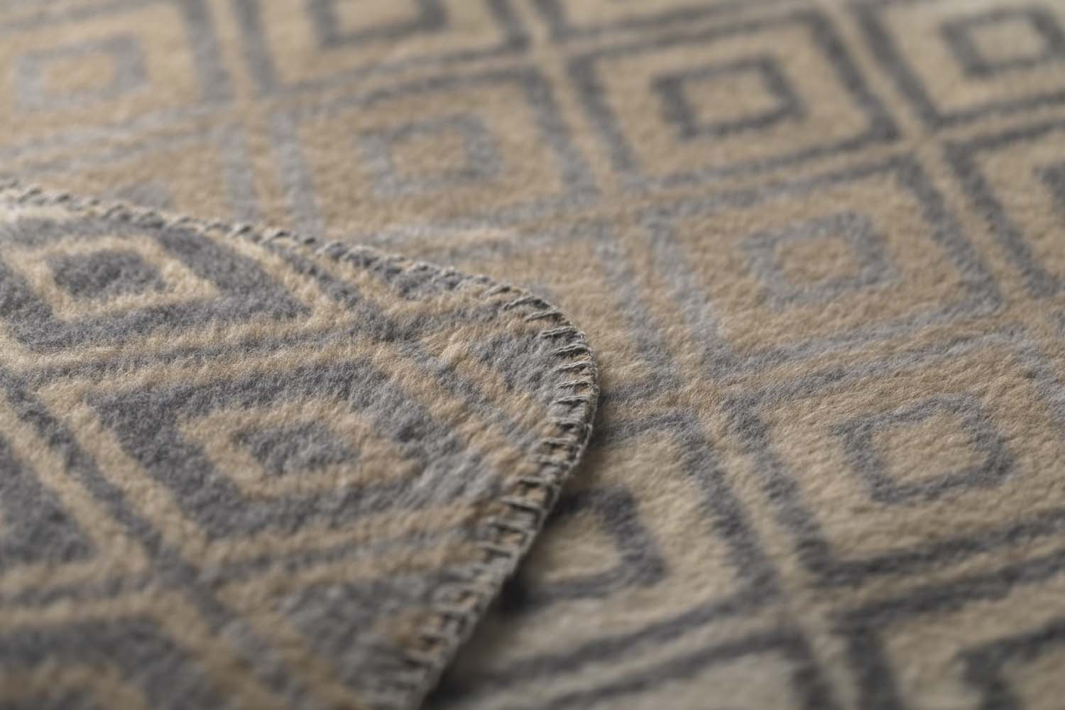 SAVONA throw "lozenge shapes gradient" in . Throw Blanket made by David Fussenegger , a family-run mill in Austria.