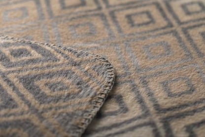 SAVONA throw "lozenge shapes gradient" in . Throw Blanket made by David Fussenegger , a family-run mill in Austria.