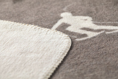 SAVONA throw "skiers leaving tracks" in . Throw Blanket made by David Fussenegger , a family-run mill in Austria.