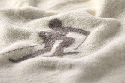 SAVONA throw "skiers leaving tracks" in . Throw Blanket made by David Fussenegger , a family-run mill in Austria.