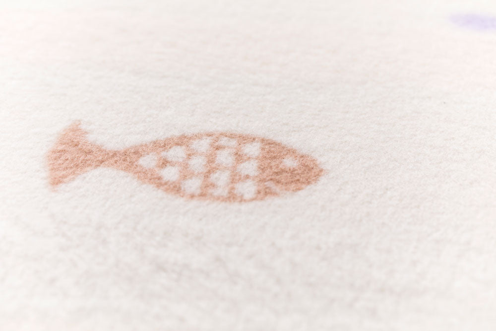 MILA baby blanket "school of fish" in . Blanket made by David Fussenegger , a family-run mill in Austria.