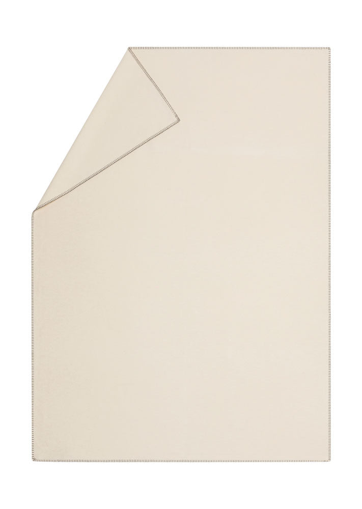 SYLT throw solid in ecru . Throw Blanket made by David Fussenegger , a family-run mill in Austria.