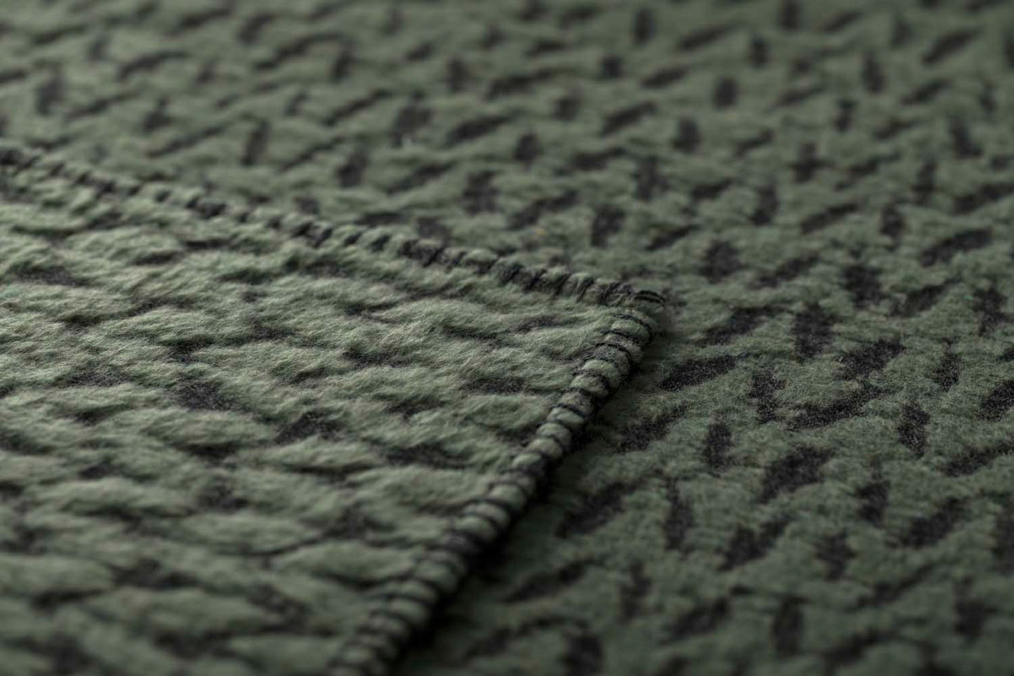 CARLA throw "knitted pattern" in . Throw Blanket made by David Fussenegger , a family-run mill in Austria.