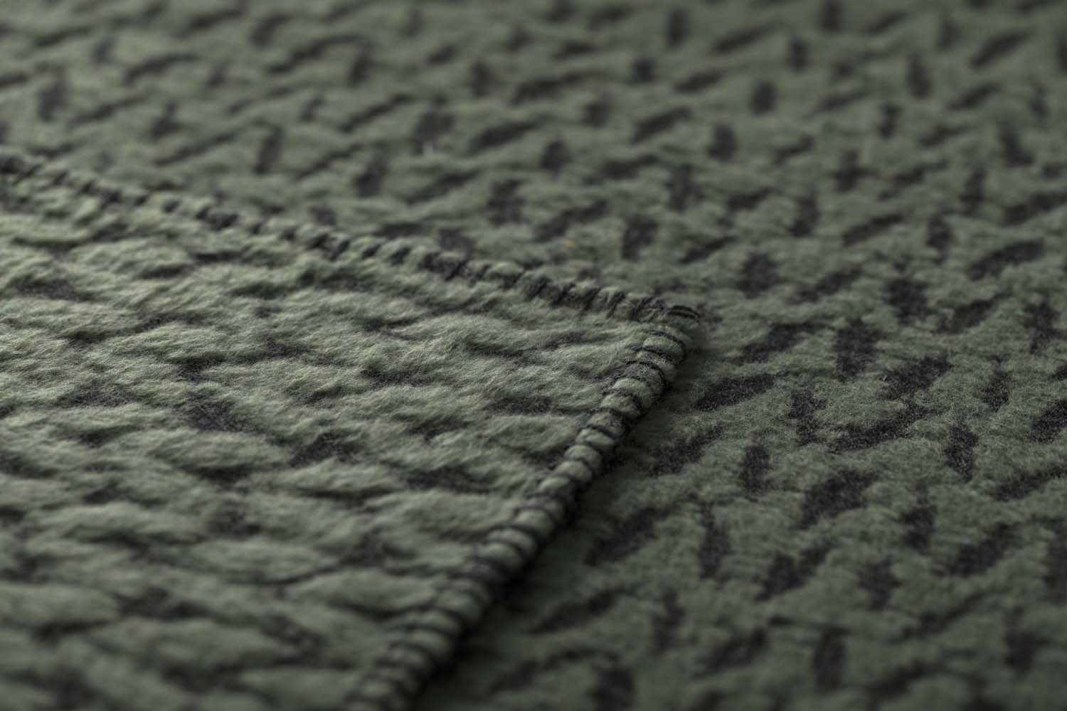 CARLA throw "knitted pattern" in . Throw Blanket made by David Fussenegger , a family-run mill in Austria.