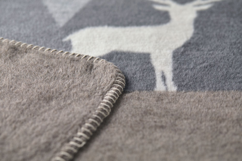 SAVONA throw "mountains modern" in . Throw Blanket made by David Fussenegger , a family-run mill in Austria.