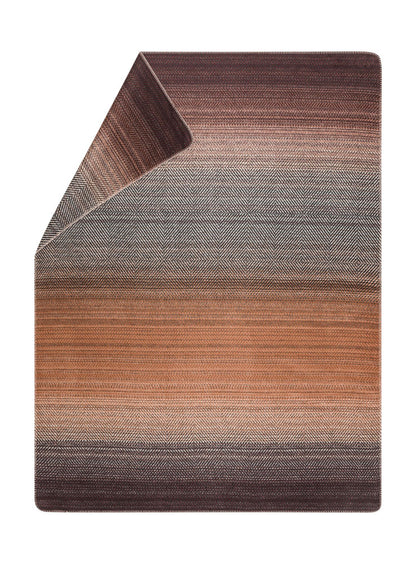 SAVONA throw "gradient herringbone" in terra cotta . Throw Blanket made by David Fussenegger , a family-run mill in Austria.