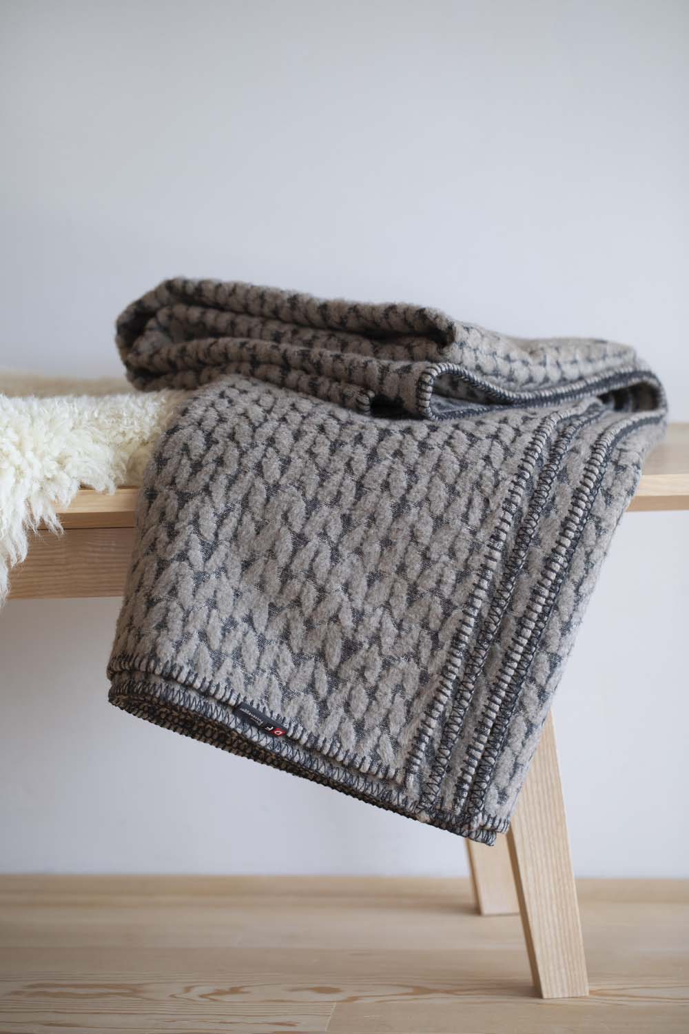 CARLA throw "knitted pattern" in . Throw Blanket made by David Fussenegger , a family-run mill in Austria.