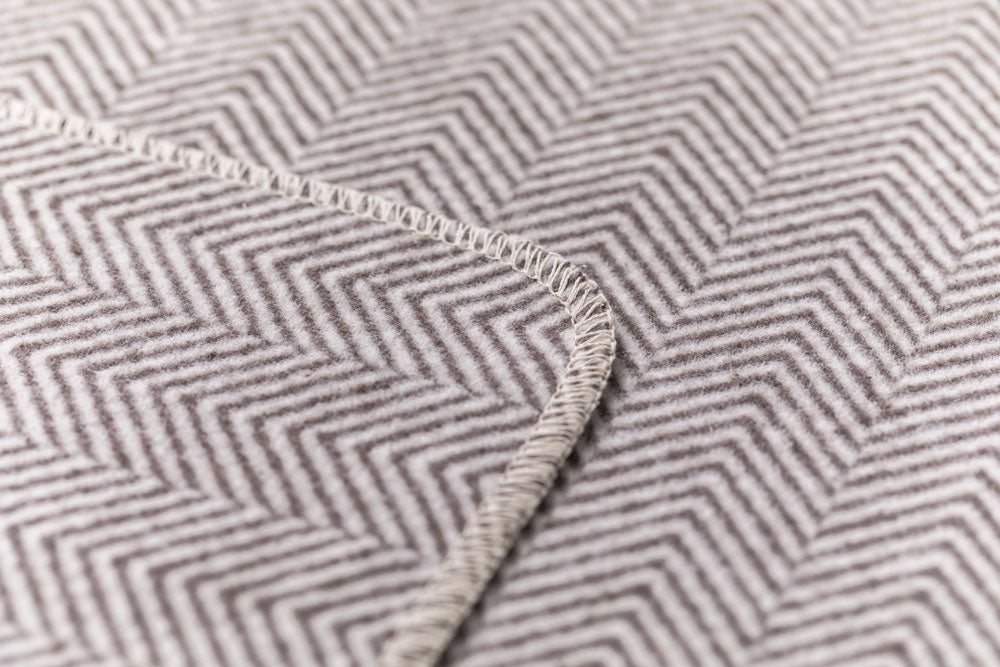 SILVRETTA throw "herringbone" in . Throw Blanket made by David Fussenegger , a family-run mill in Austria.