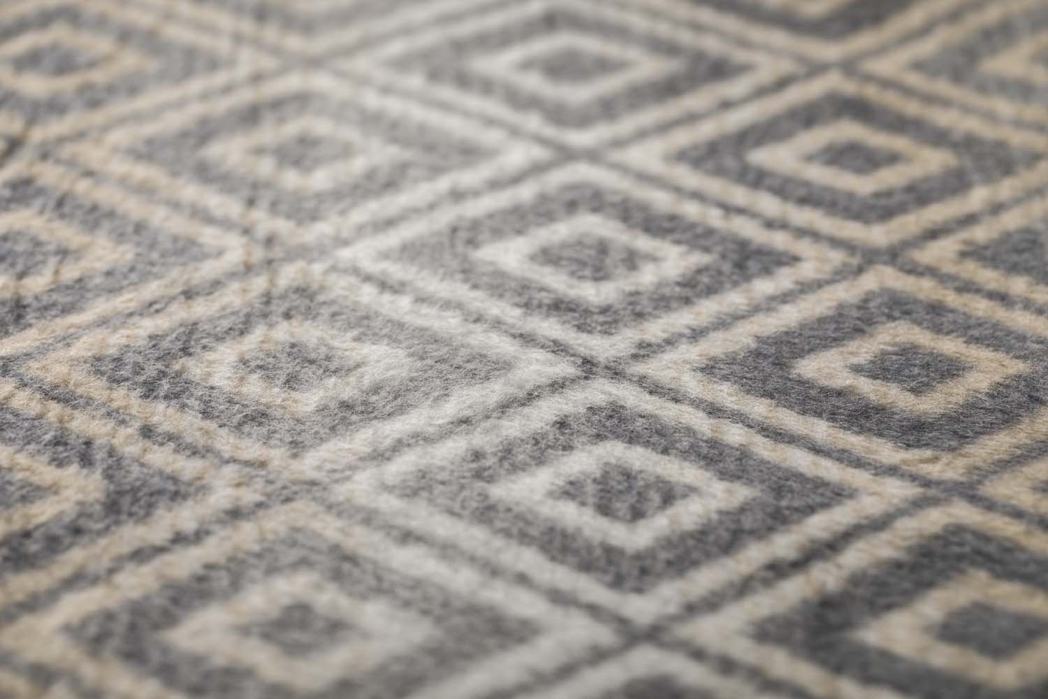 SAVONA throw "lozenge shapes gradient" in . Throw Blanket made by David Fussenegger , a family-run mill in Austria.