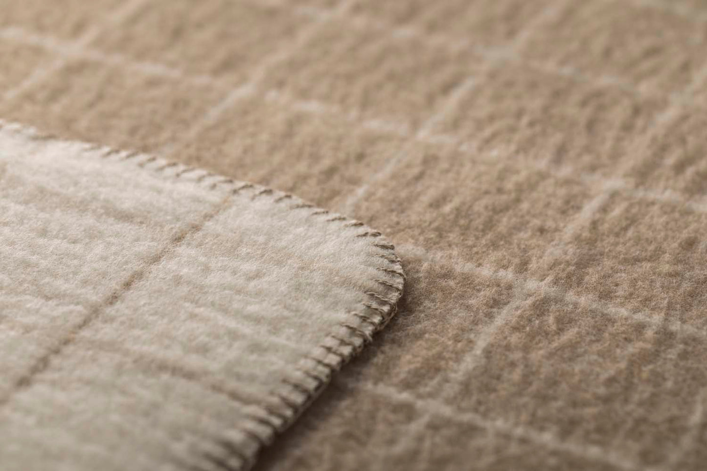 MERANO throw "checkered" in . made by INDIGO 11 , a family-run mill in Austria.