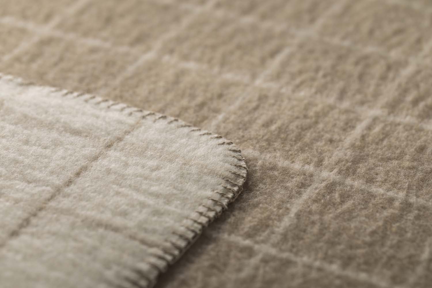 MERANO throw "checkered" in . made by INDIGO 11 , a family-run mill in Austria.