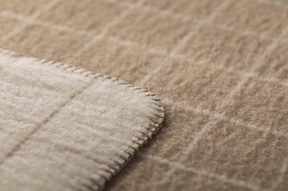 MERANO throw "checkered" in . made by INDIGO 11 , a family-run mill in Austria.