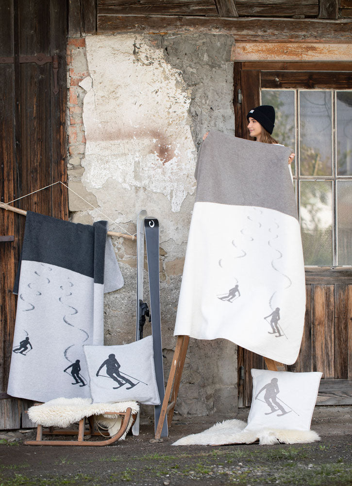 SAVONA throw "skiers leaving tracks" in . Throw Blanket made by David Fussenegger , a family-run mill in Austria.