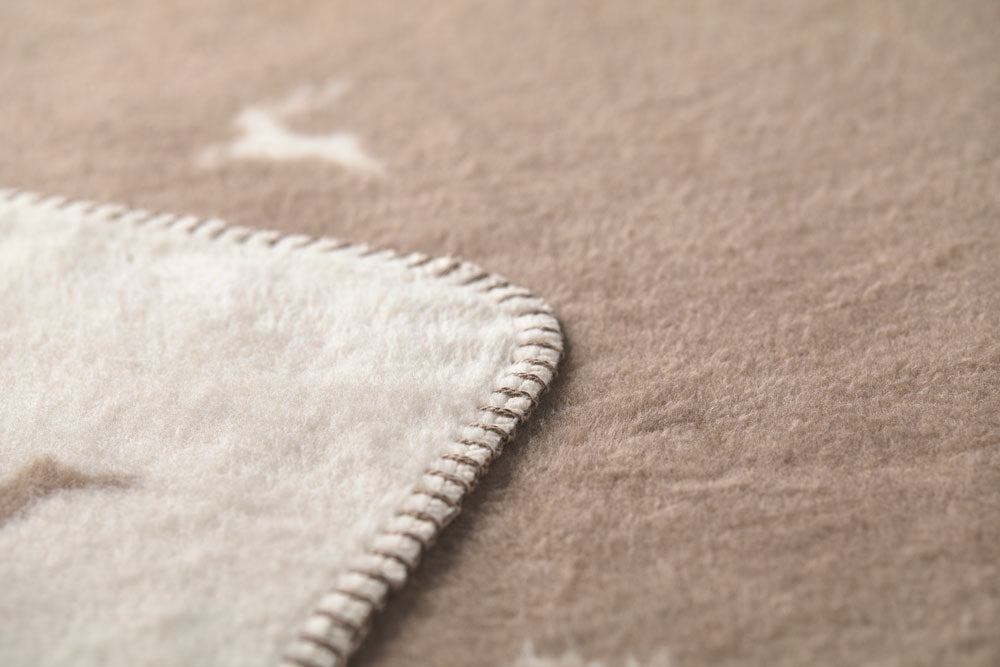 SAVONA throw "deer allover" in . Throw Blanket made by David Fussenegger , a family-run mill in Austria.