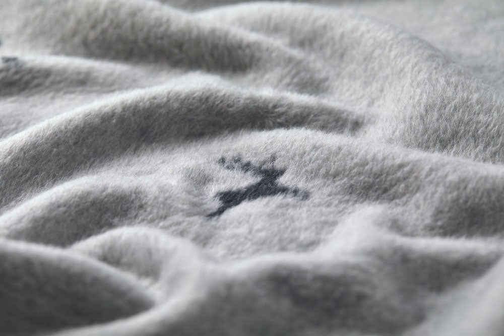 SAVONA throw "deer allover" in . Throw Blanket made by David Fussenegger , a family-run mill in Austria.