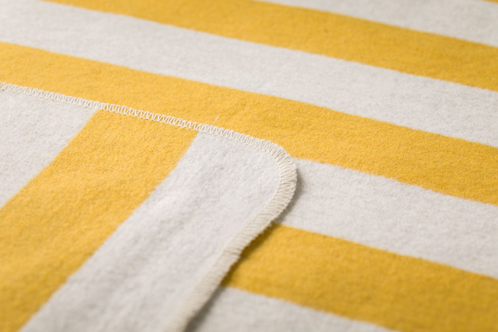 JUWEL baby blanket "stripes with bees" with embroidery in . Blanket made by David Fussenegger , a family-run mill in Austria.