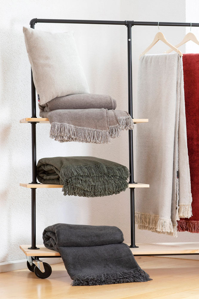VIENNA throw solid with fringe in . Throw Blanket made by David Fussenegger , a family-run mill in Austria.