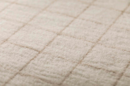 MERANO throw "checkered" in . made by INDIGO 11 , a family-run mill in Austria.
