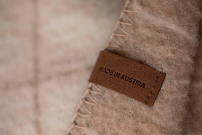 MERANO throw "checkered" in . made by INDIGO 11 , a family-run mill in Austria.