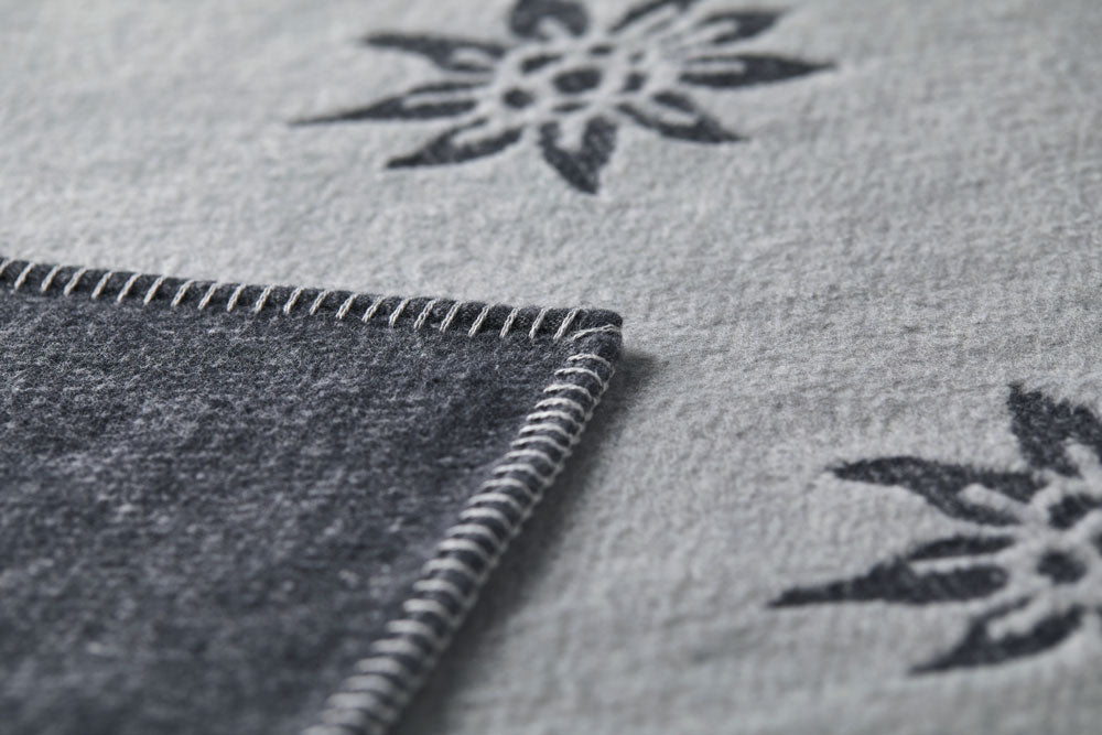 CARLA throw "Edelweiß" in . Throw Blanket made by David Fussenegger , a family-run mill in Austria.