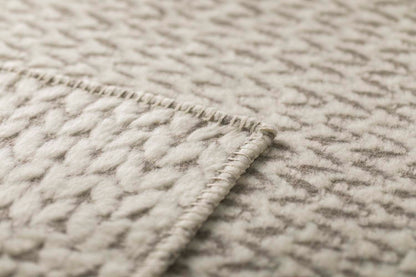 CARLA throw "knitted pattern" in . Throw Blanket made by David Fussenegger , a family-run mill in Austria.