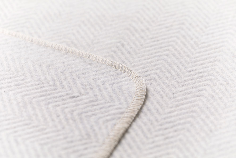 SILVRETTA throw "herringbone" in . Throw Blanket made by David Fussenegger , a family-run mill in Austria.