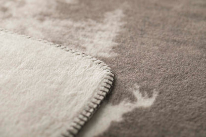 SAVONA throw "snowy trees/stag" in . Throw Blanket made by David Fussenegger , a family-run mill in Austria.