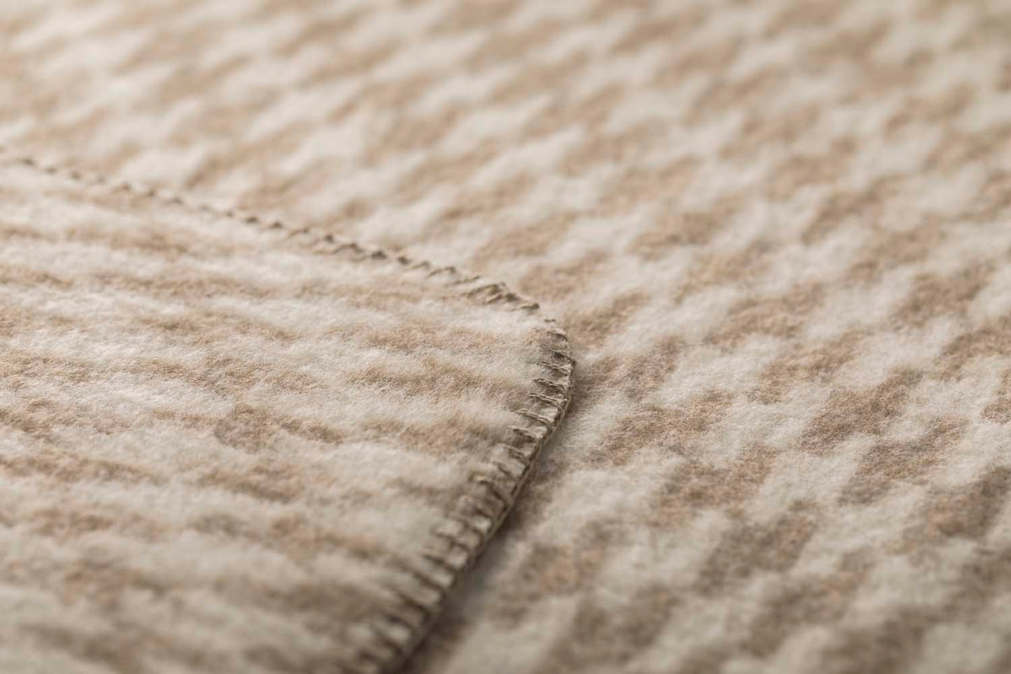 MERANO throw "houndstooth" in . made by INDIGO 11 , a family-run mill in Austria.