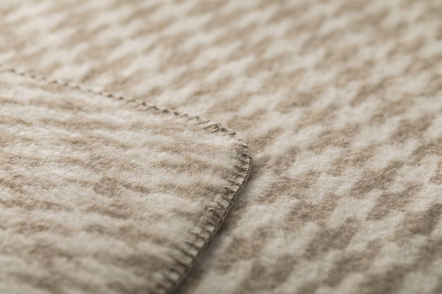 MERANO throw "houndstooth" in . made by INDIGO 11 , a family-run mill in Austria.