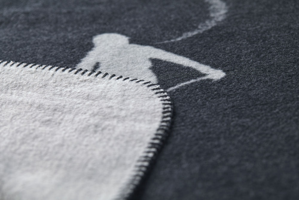 SAVONA throw "skiers leaving tracks" in . Throw Blanket made by David Fussenegger , a family-run mill in Austria.