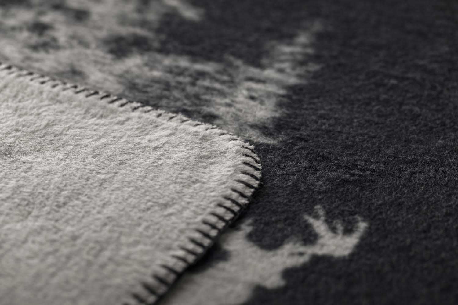 SAVONA throw "snowy trees/stag" in . Throw Blanket made by David Fussenegger , a family-run mill in Austria.