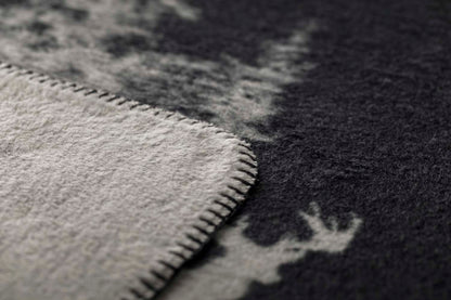 SAVONA throw "snowy trees/stag" in . Throw Blanket made by David Fussenegger , a family-run mill in Austria.