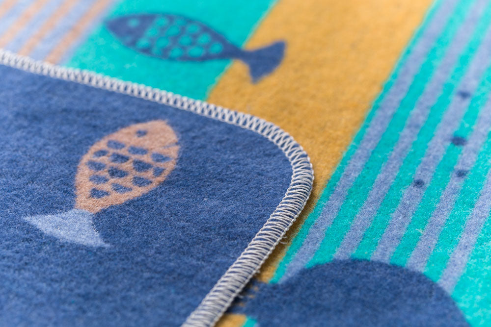 JUWEL toddler blanket "fish allover" in . Blanket made by David Fussenegger , a family-run mill in Austria.